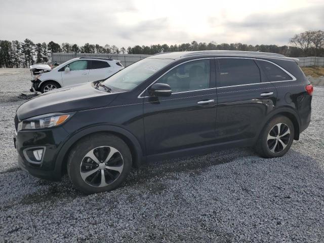 KIA SORENTO EX 2016 with VIN 5XYPH4A56GG166990 - Photo from auction