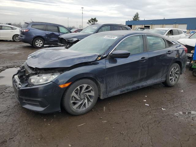 HONDA CIVIC EX 2018 with VIN 19XFC2F7XJE013686 - Photo from auction