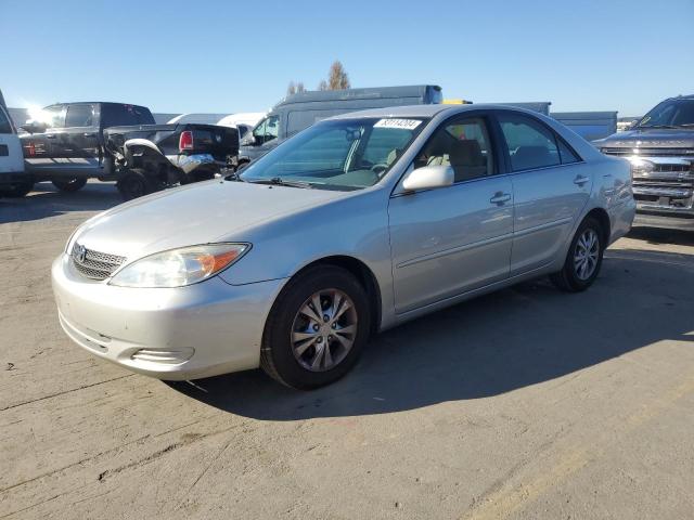 TOYOTA CAMRY LE 2004 with VIN 4T1BF32K14U077719 - Photo from auction