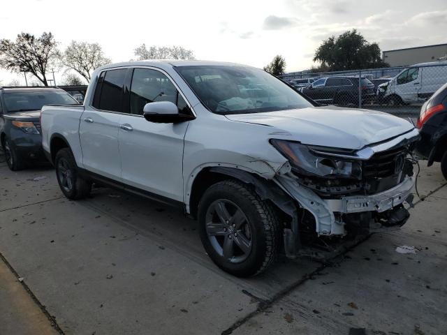 Photo 4 from auction – 2022 HONDA RIDGELINE with VIN 5FPYK3F78NB023853