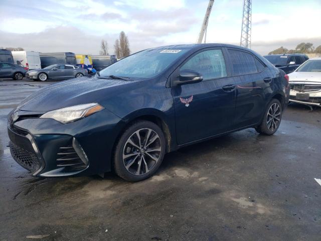 TOYOTA COROLLA L 2017 with VIN 5YFBURHE9HP651341 - Photo from auction