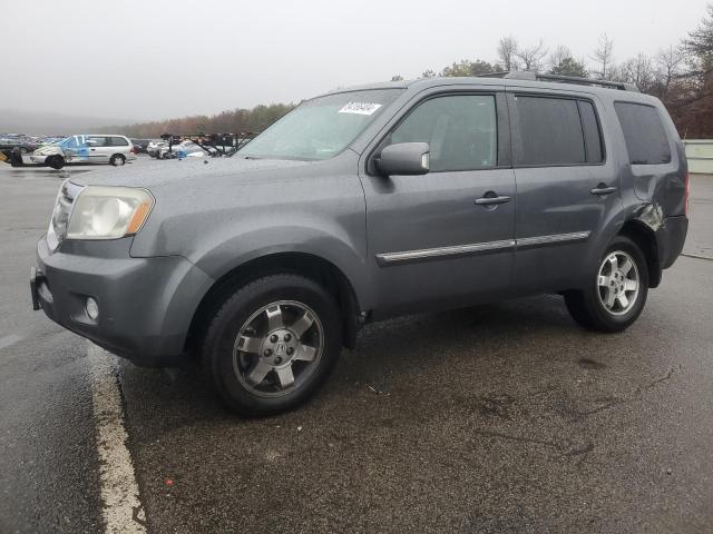 HONDA PILOT TOUR 2011 with VIN 5FNYF4H97BB100841 - Photo from auction