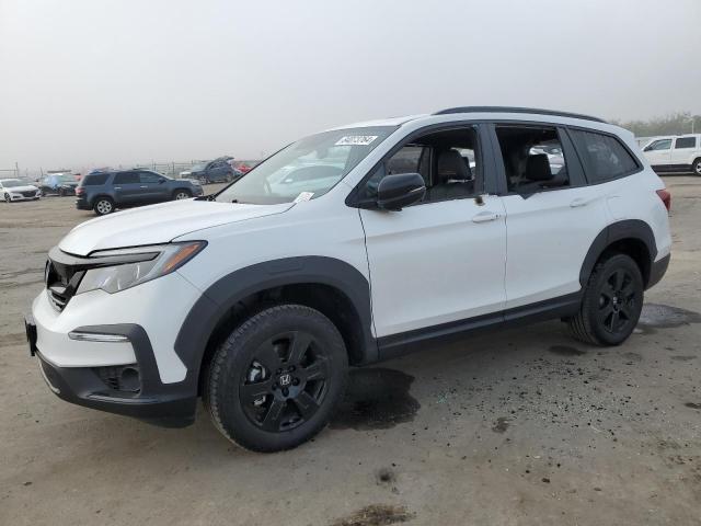 HONDA PILOT TRAI 2022 with VIN 5FNYF6H83NB077596 - Photo from auction