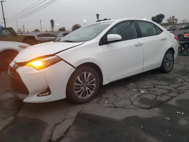 TOYOTA COROLLA L 2018 with VIN 5YFBURHE9JP785112 - Photo from auction