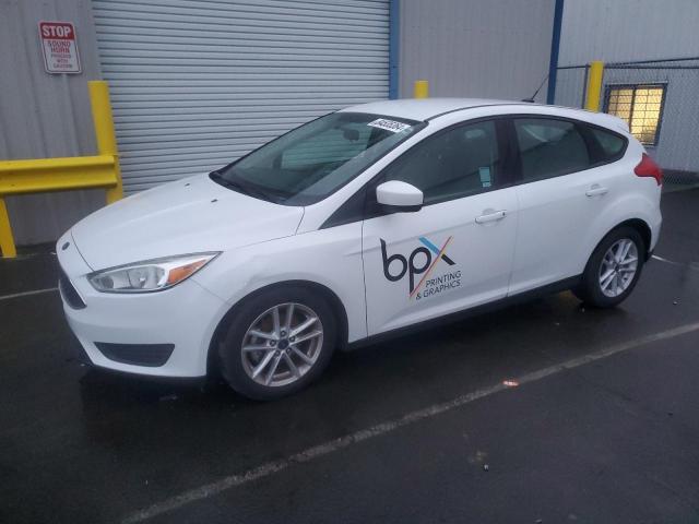 FORD FOCUS SE 2018 with VIN 1FADP3K29JL323093 - Photo from auction