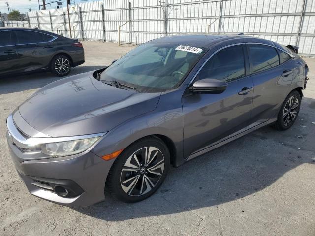 HONDA CIVIC EX 2017 with VIN 19XFC1F39HE033333 - Photo from auction