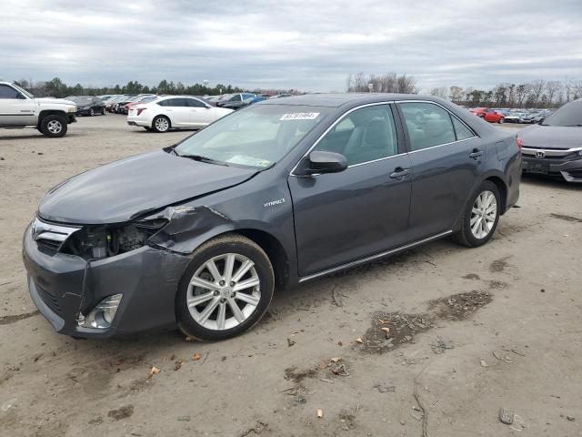 TOYOTA CAMRY HYBR 2012 with VIN 4T1BD1FK0CU011648 - Photo from auction