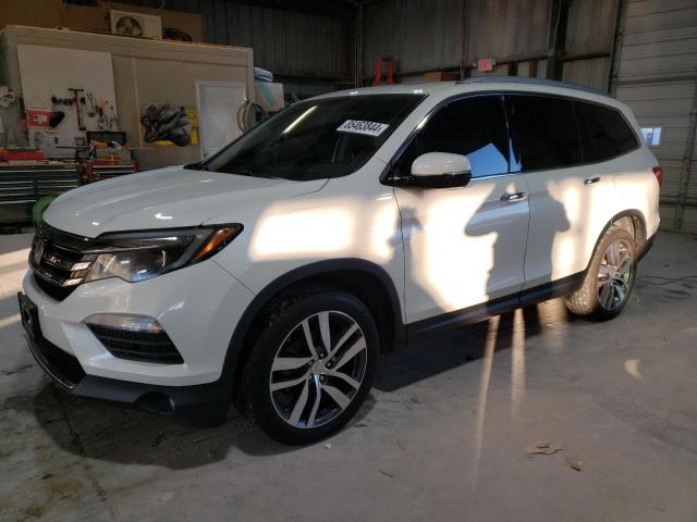 HONDA PILOT TOUR 2016 with VIN 5FNYF6H94GB071706 - Photo from auction