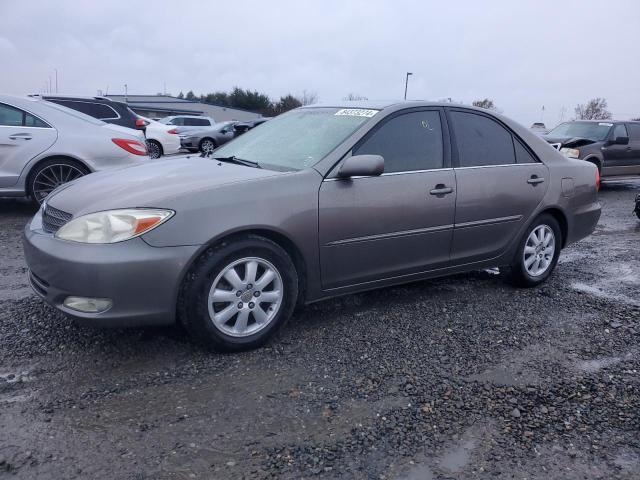 TOYOTA CAMRY LE 2003 with VIN 4T1BF30K03U554674 - Photo from auction