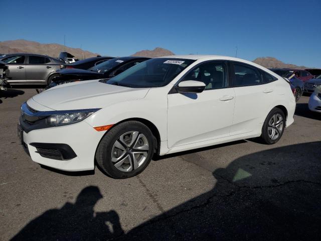 HONDA CIVIC LX 2018 with VIN 19XFC2F50JE020869 - Photo from auction
