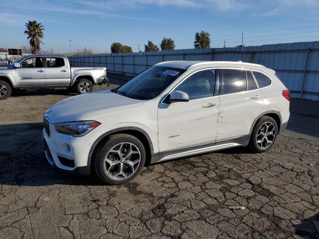 BMW X1 XDRIVE2 2016 with VIN WBXHT3C36GP889568 - Photo from auction