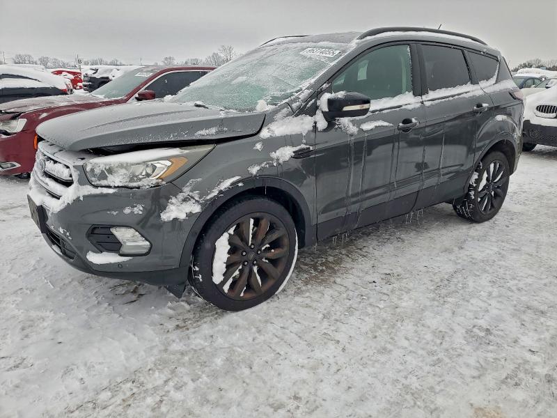 FORD ESCAPE TIT 2018 with VIN 1FMCU9J98JUA00417 - Photo from auction