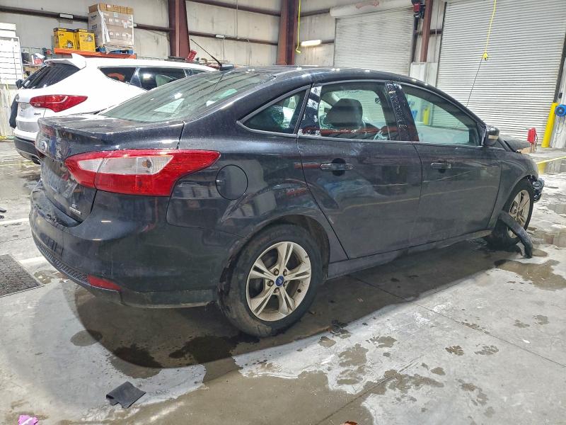 Photo 3 from auction – 2013 FORD FOCUS with VIN 1FADP3F26DL309196