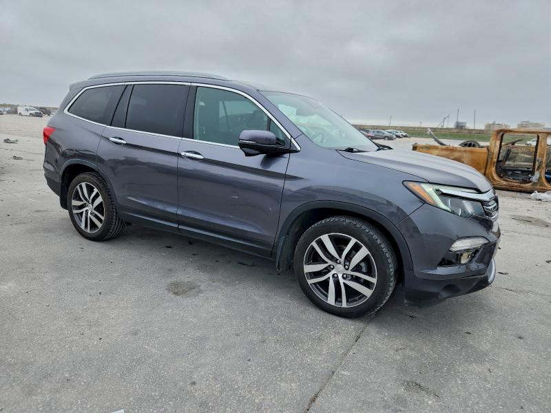 Photo 4 from auction – 2018 HONDA PILOT TOUR with VIN 5FNYF5H90JB030152
