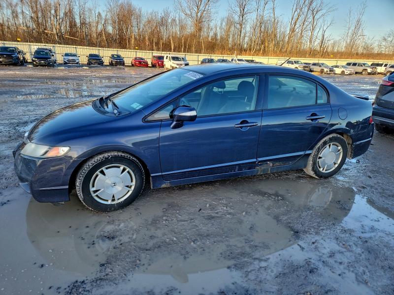 HONDA CIVIC HYBR 2010 with VIN JHMFA3F26AS004110 - Photo from auction