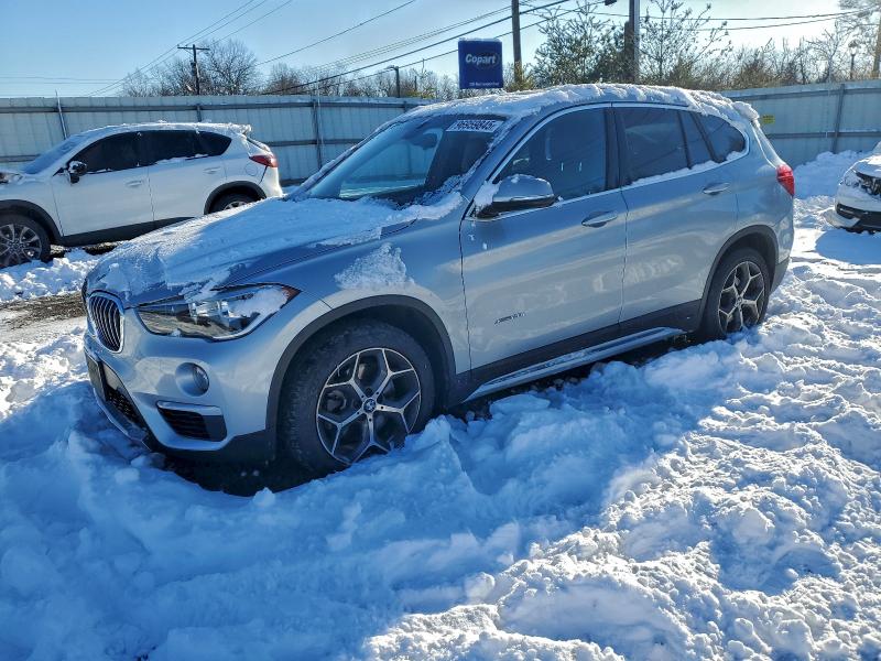 BMW X1 XDRIVE2 2018 with VIN WBXHT3C30J5K31327 - Photo from auction