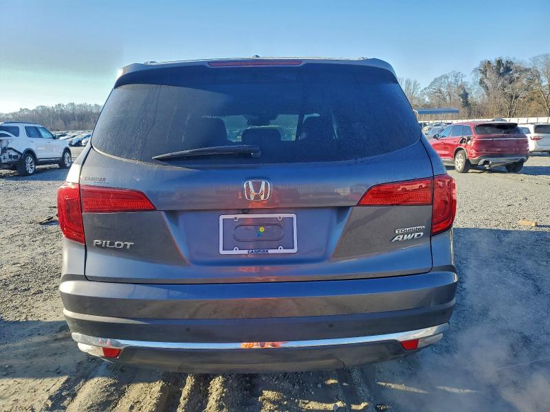 Photo 6 from auction – 2016 HONDA PILOT TOUR with VIN 5FNYF6H98GB114041