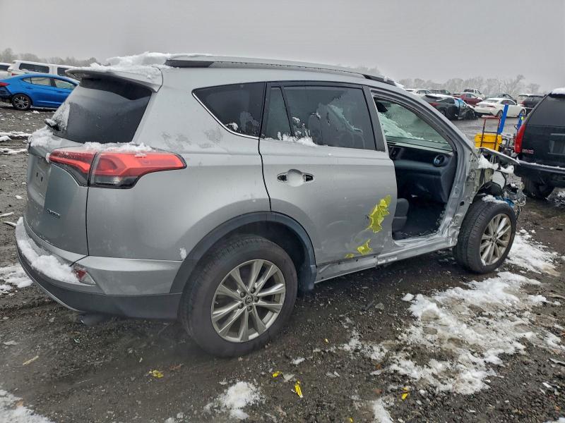 Photo 3 from auction – 2018 TOYOTA RAV4 LIMIT with VIN 2T3YFREV2JW450160