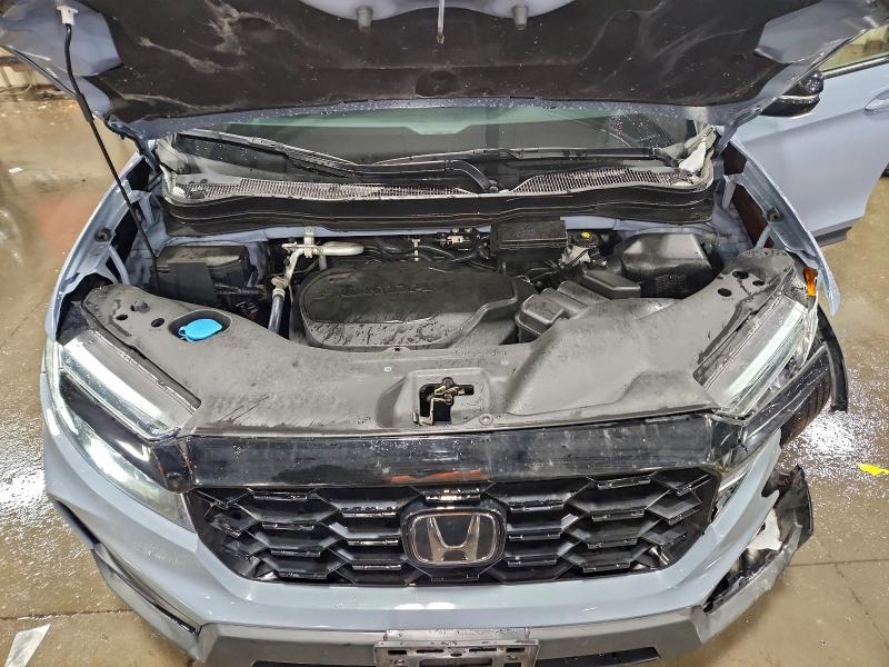 Photo 12 from auction – 2022 HONDA PASSPORT E with VIN 5FNYF8H07NB006178