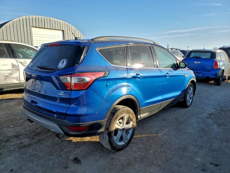 Photo 3 from auction – 2018 FORD ESCAPE with VIN 1FMCU9GD3JUA97487