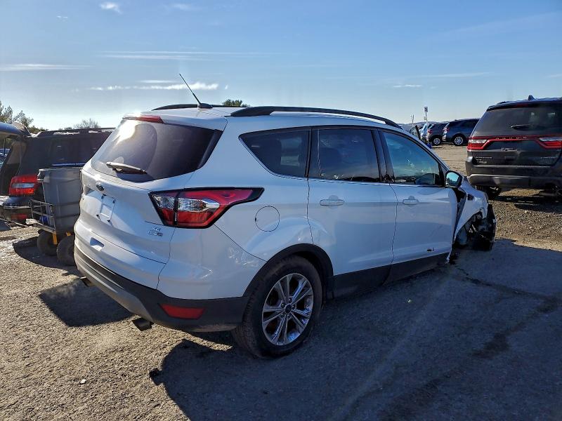 Photo 3 from auction – 2017 FORD ESCAPE with VIN 1FMCU9GD0HUD99300