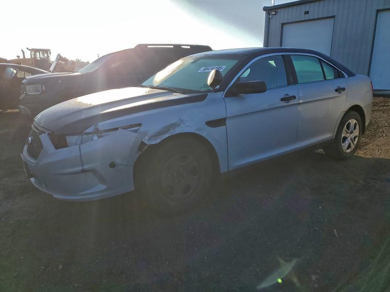 FORD TAURUS POL 2015 with VIN 1FAHP2MKXFG162231 - Photo from auction