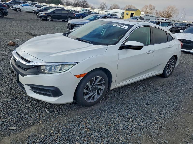 HONDA CIVIC EX 2018 with VIN 19XFC2F71JE202355 - Photo from auction