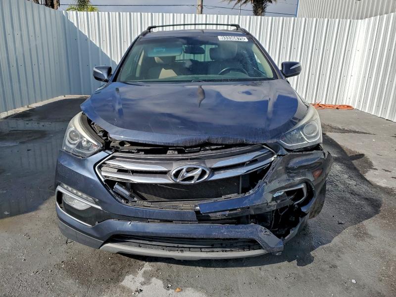 Photo 5 from auction – 2018 HYUNDAI SANTA FE S with VIN 5NMZU3LB1JH103150