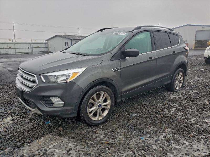FORD ESCAPE SE 2018 with VIN 1FMCU9GDXJUA81268 - Photo from auction