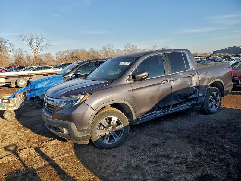 HONDA RIDGELINE 2017 with VIN 5FPYK3F66HB002964 - Photo from auction