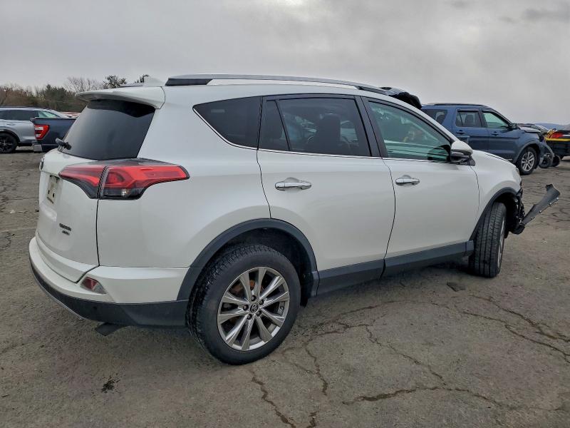 Photo 3 from auction – 2018 TOYOTA RAV4 LIMIT with VIN 2T3DFREV3JW788424