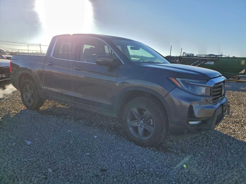 Photo 4 from auction – 2023 HONDA RIDGELINE with VIN 5FPYK3F55PB053488