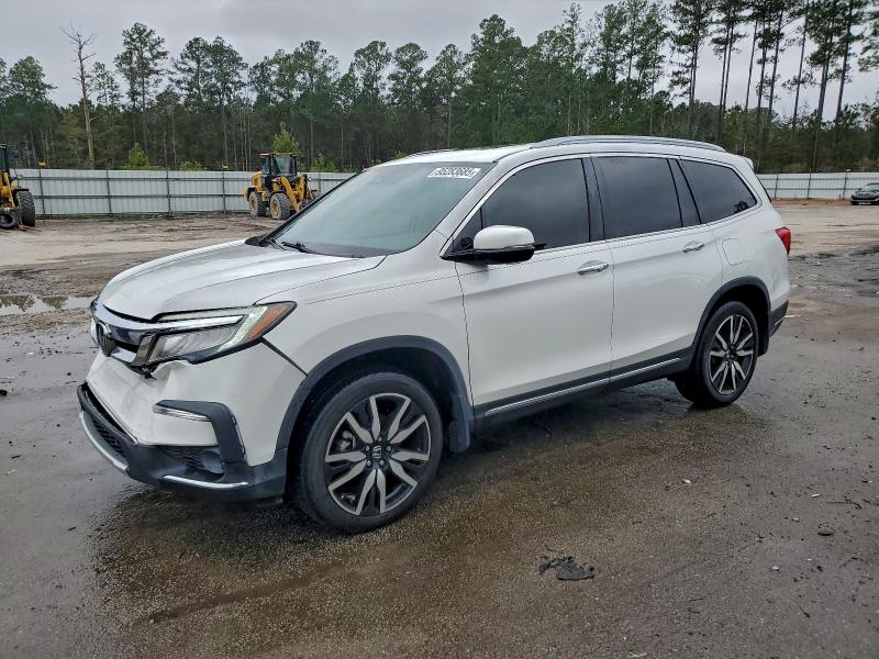 HONDA PILOT TOUR 2021 with VIN 5FNYF5H64MB012571 - Photo from auction