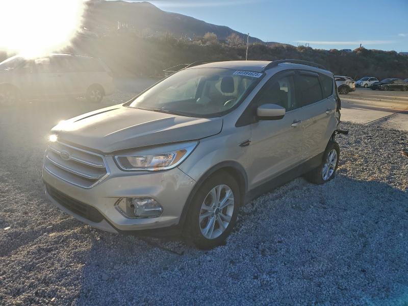 FORD ESCAPE 2018 with VIN 1FMCU9GD0JUA06255 - Photo from auction