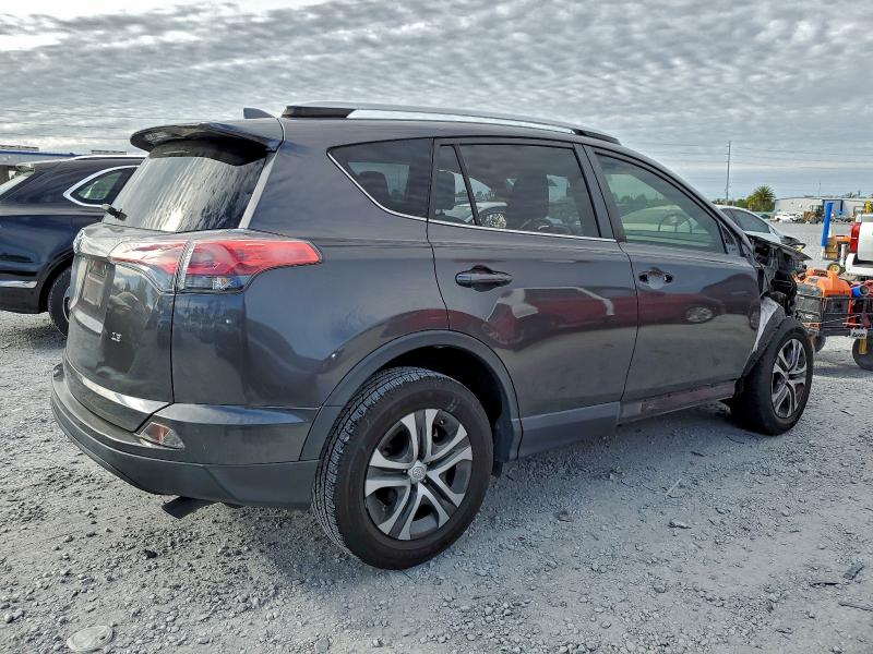 Photo 3 from auction – 2016 TOYOTA RAV4 LE with VIN JTMZFREV1GJ082792