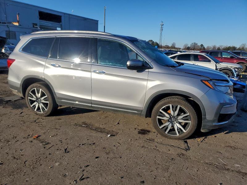 Photo 4 from auction – 2022 HONDA PILOT TOUR with VIN 5FNYF6H65NB062192