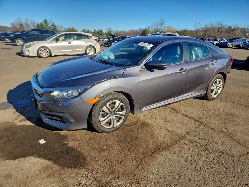 HONDA CIVIC LX 2017 with VIN 19XFC2F52HE038851 - Photo from auction
