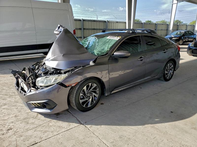 HONDA CIVIC EX 2018 with VIN 19XFC2F77JE027464 - Photo from auction