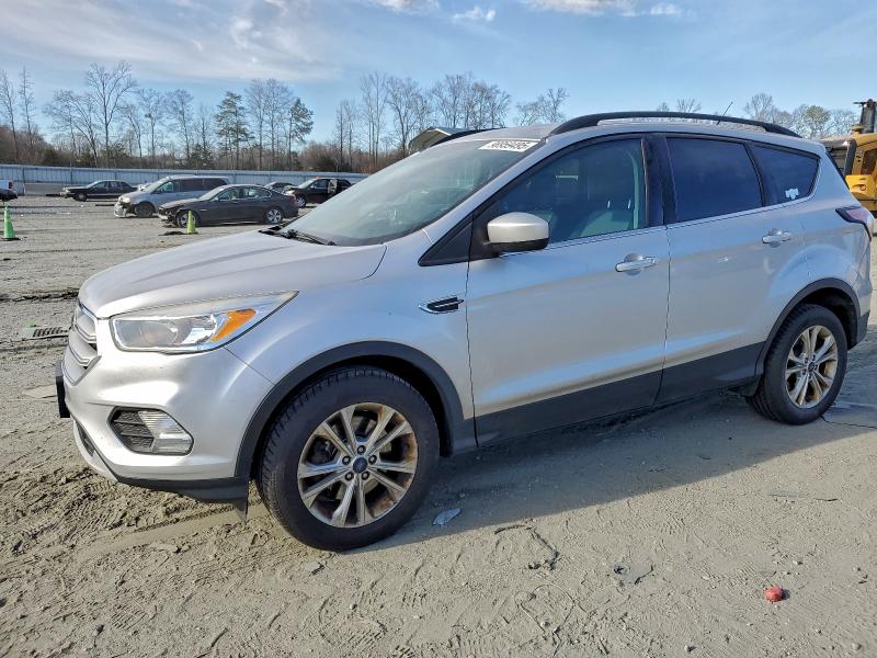 FORD ESCAPE SE 2018 with VIN 1FMCU9GD0JUB74798 - Photo from auction