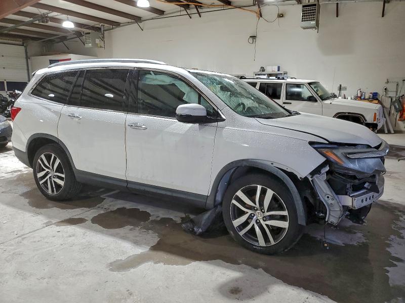 Photo 4 from auction – 2016 HONDA PILOT ELIT with VIN 5FNYF6H07GB128109