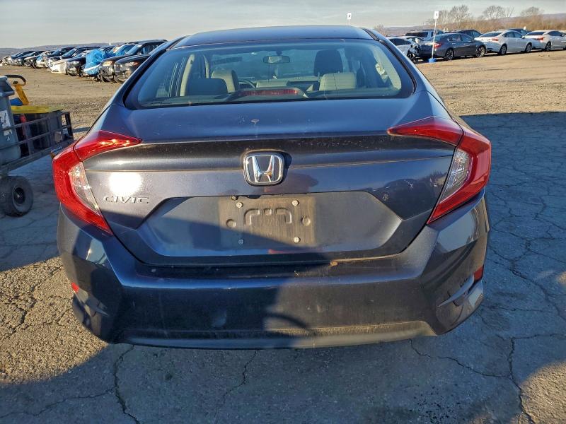 Photo 6 from auction – 2017 HONDA CIVIC LX with VIN 2HGFC2F58HH555092