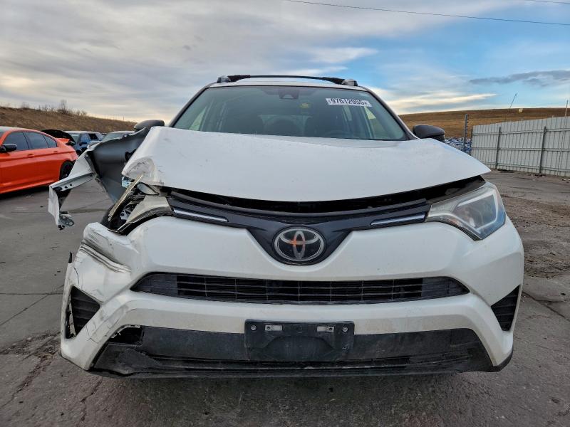 Photo 5 from auction – 2018 TOYOTA RAV4 LE with VIN JTMBFREV9JJ250073