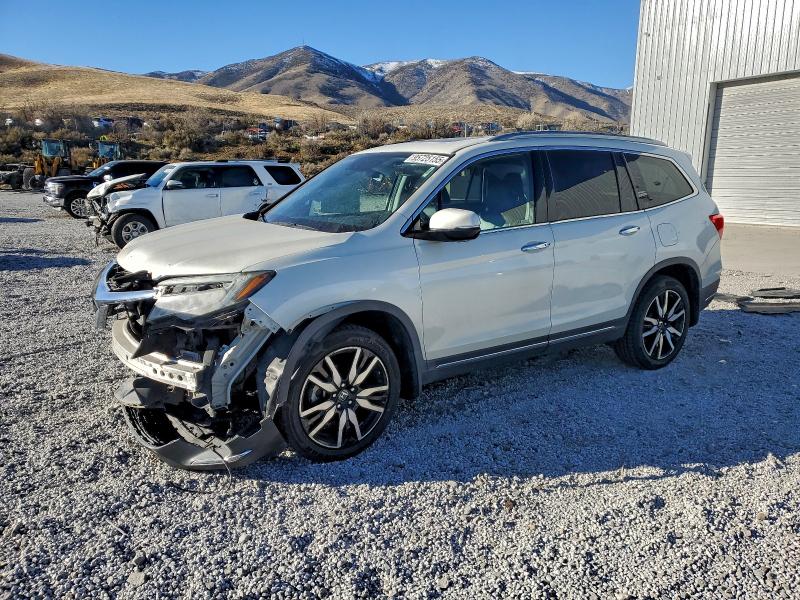 HONDA PILOT TOUR 2019 with VIN 5FNYF6H9XKB044258 - Photo from auction