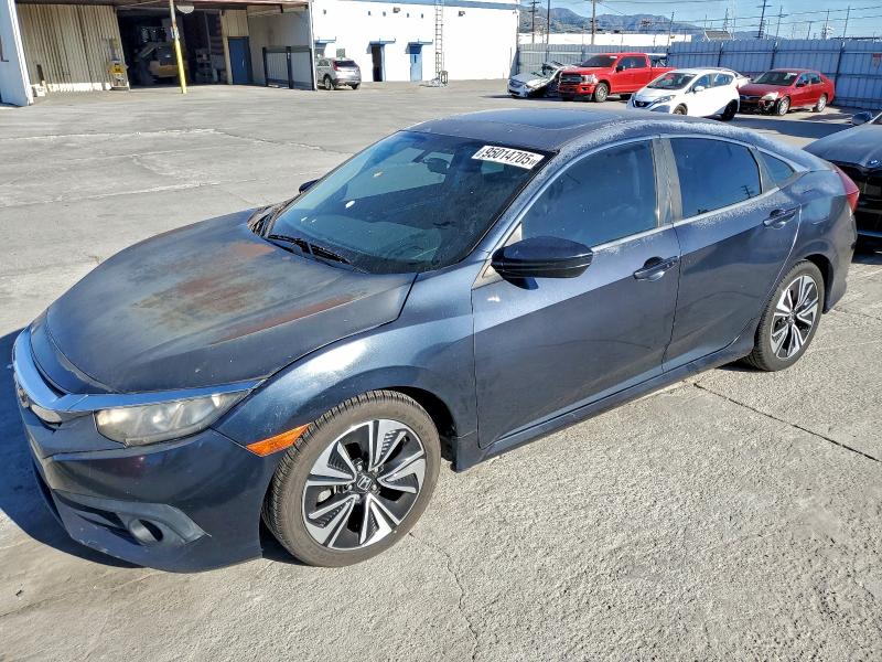 HONDA CIVIC EX 2017 with VIN 2HGFC1F3XHH631761 - Photo from auction