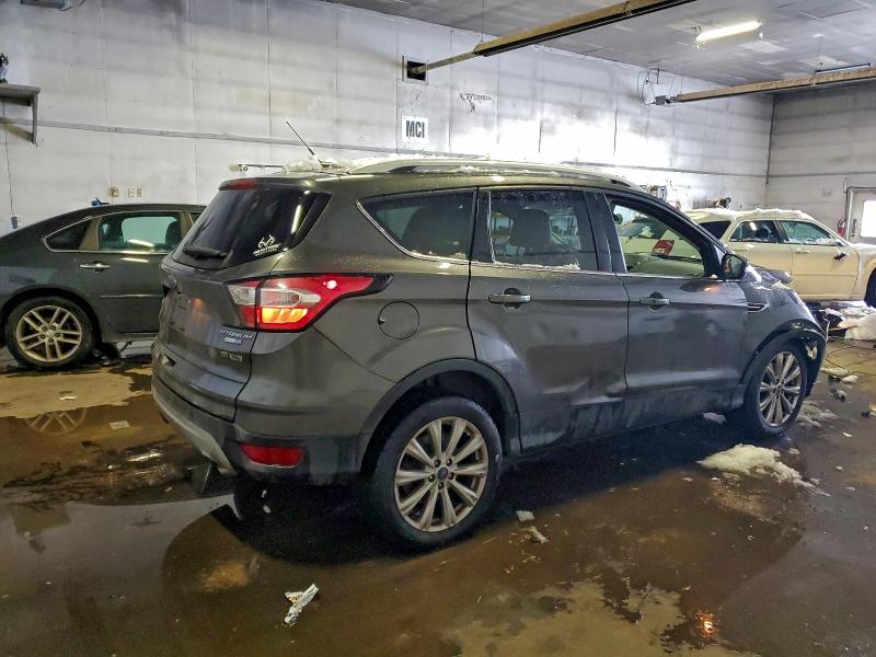 Photo 3 from auction – 2017 FORD ESCAPE with VIN 1FMCU9J94HUD60343