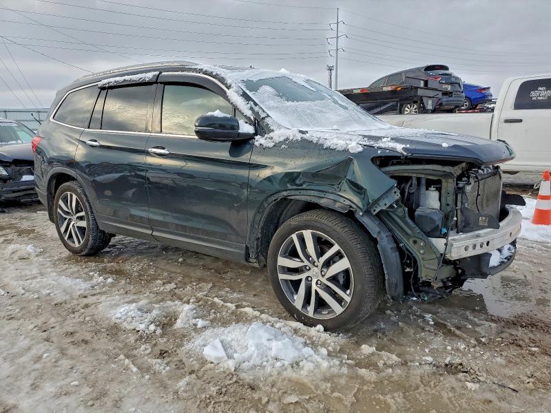 Photo 4 from auction – 2016 HONDA PILOT ELIT with VIN 5FNYF6H02GB090367