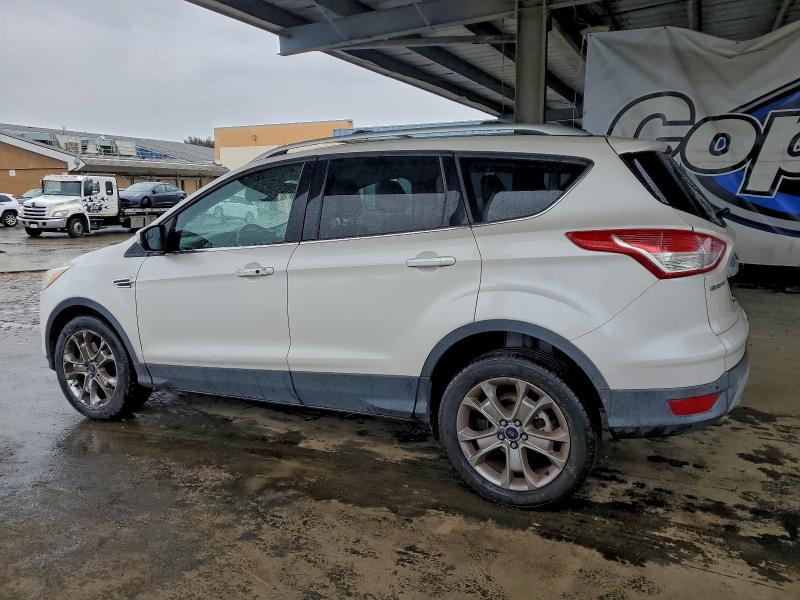Photo 2 from auction – 2014 FORD ESCAPE TIT with VIN 1FMCU9J9XEUB08950