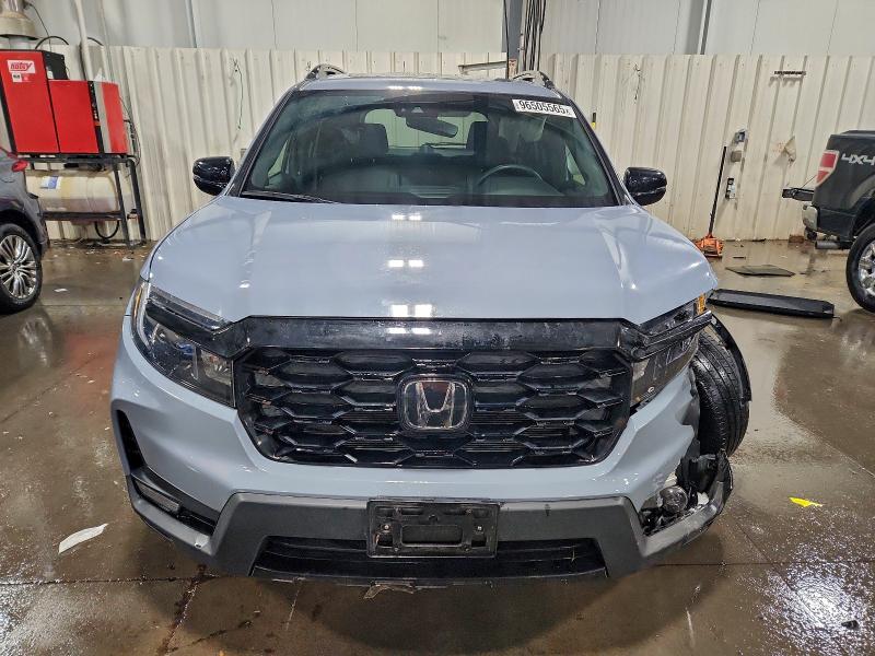 Photo 5 from auction – 2022 HONDA PASSPORT E with VIN 5FNYF8H07NB006178