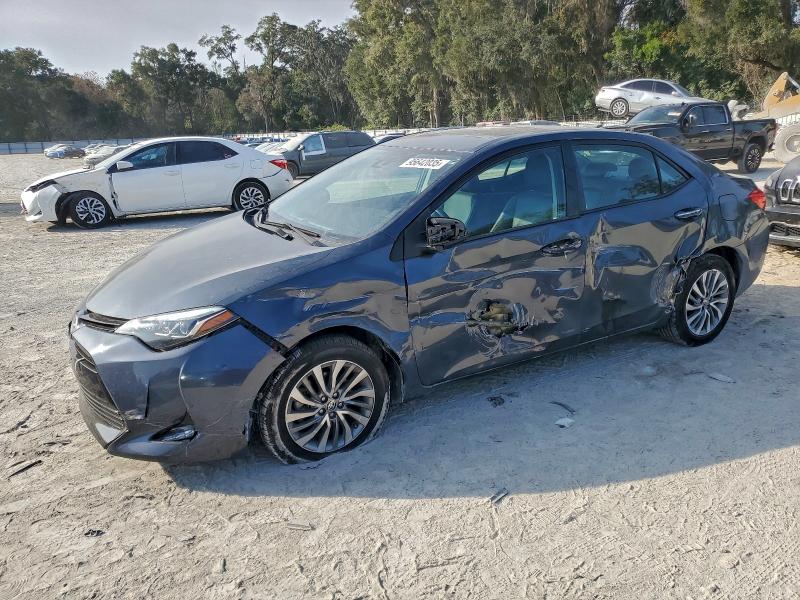 TOYOTA COROLLA L 2018 with VIN 5YFBURHE2JP749293 - Photo from auction