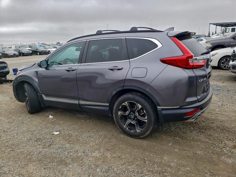 Photo 2 from auction – 2018 HONDA CR-V with VIN 7FARW2H96JE088581